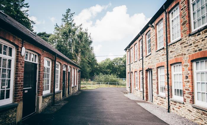 There are two stone-built workshops, each with lots of windows. The museum is housed in the former Cambrian Woollen Mill.